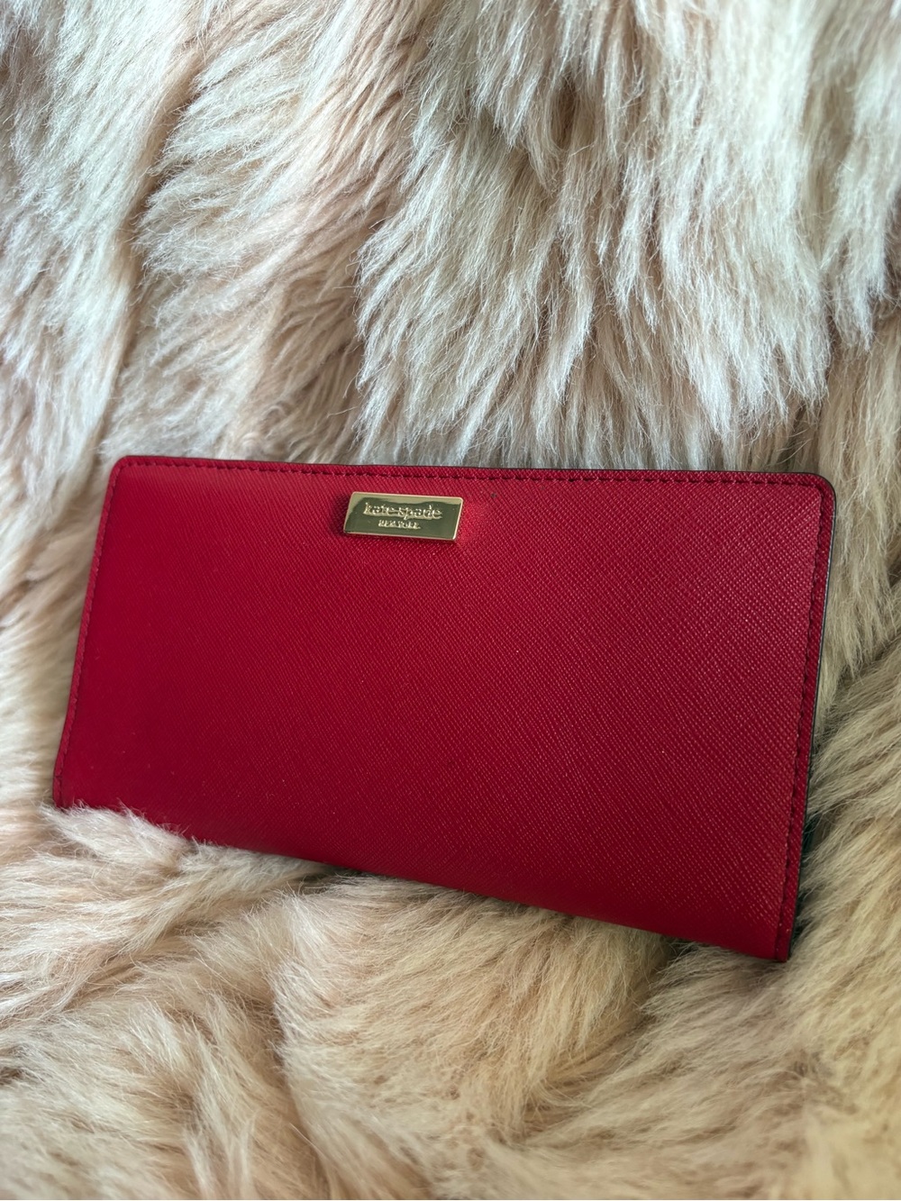 Kate Spade red saffiano wallet with gold accents